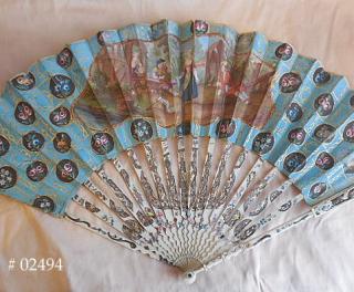 Circa 1760 fan, the parchment leaf hand painted with vignette of two young couples, on a "bleu celeste" ground