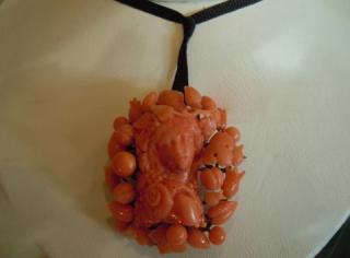 Head of a Bacchante, carved deep salmon color coral, on gold wire understructure