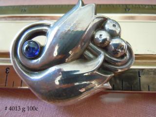 Georg Jensen sterling "Tulip" brooch, set with a cabochon-cut synthetic (laboratory grown) blue sapphire