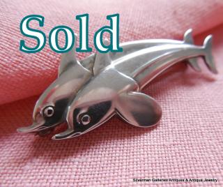 DOLPHINS, Georg Jensen # 317, designed by Arno Malinowski (1899-1976)