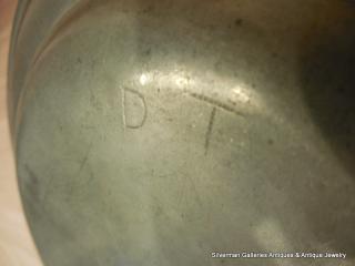 Initials of the original owner, "D T"