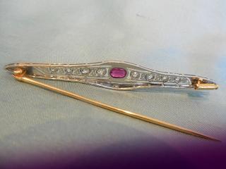 detail, verso -- All Platinum, except for the gold pin and catch