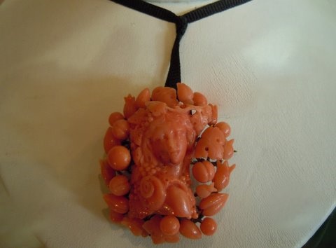 Head of a Bacchante, carved deep salmon color coral, on gold wire understructure