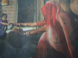 Photograph of a Rajasthan woman at home wearing traditional bracelets