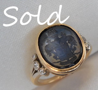 Blue Sapphire Armorial Ring with six Antique Diamonds
