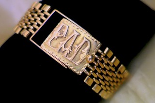 Hinged 3/4 x 7/8"gold box lock with applied monogram letters