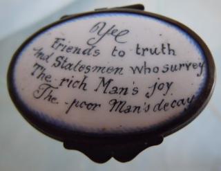 Motto is hand-painted in enamel before firing